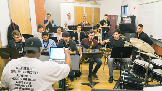 Ralph Peterson works with students